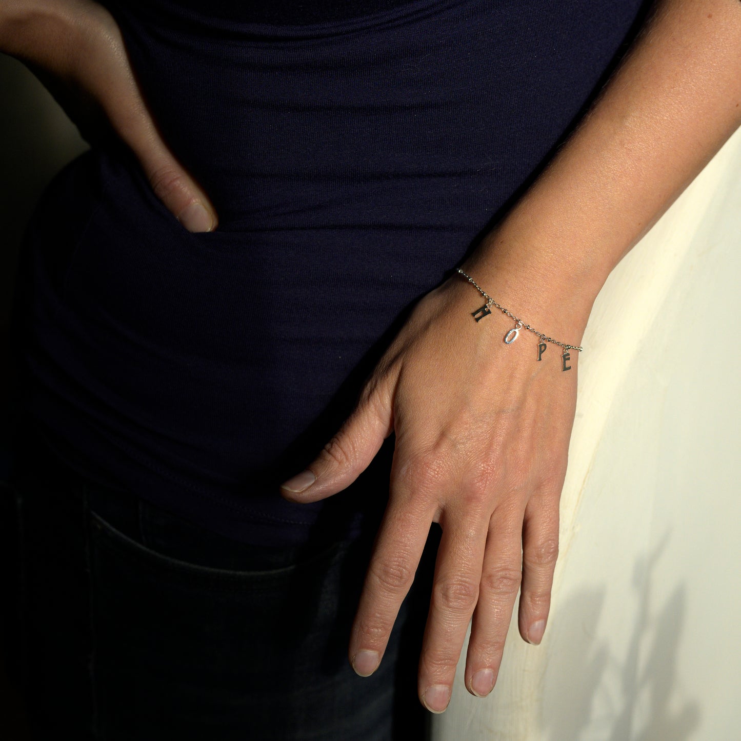 Silver hope bracelet on model's wrist