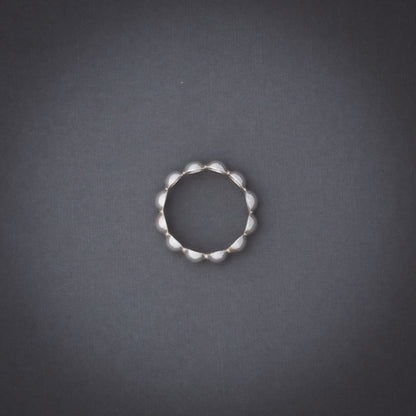Product shot of silver domes ring from above